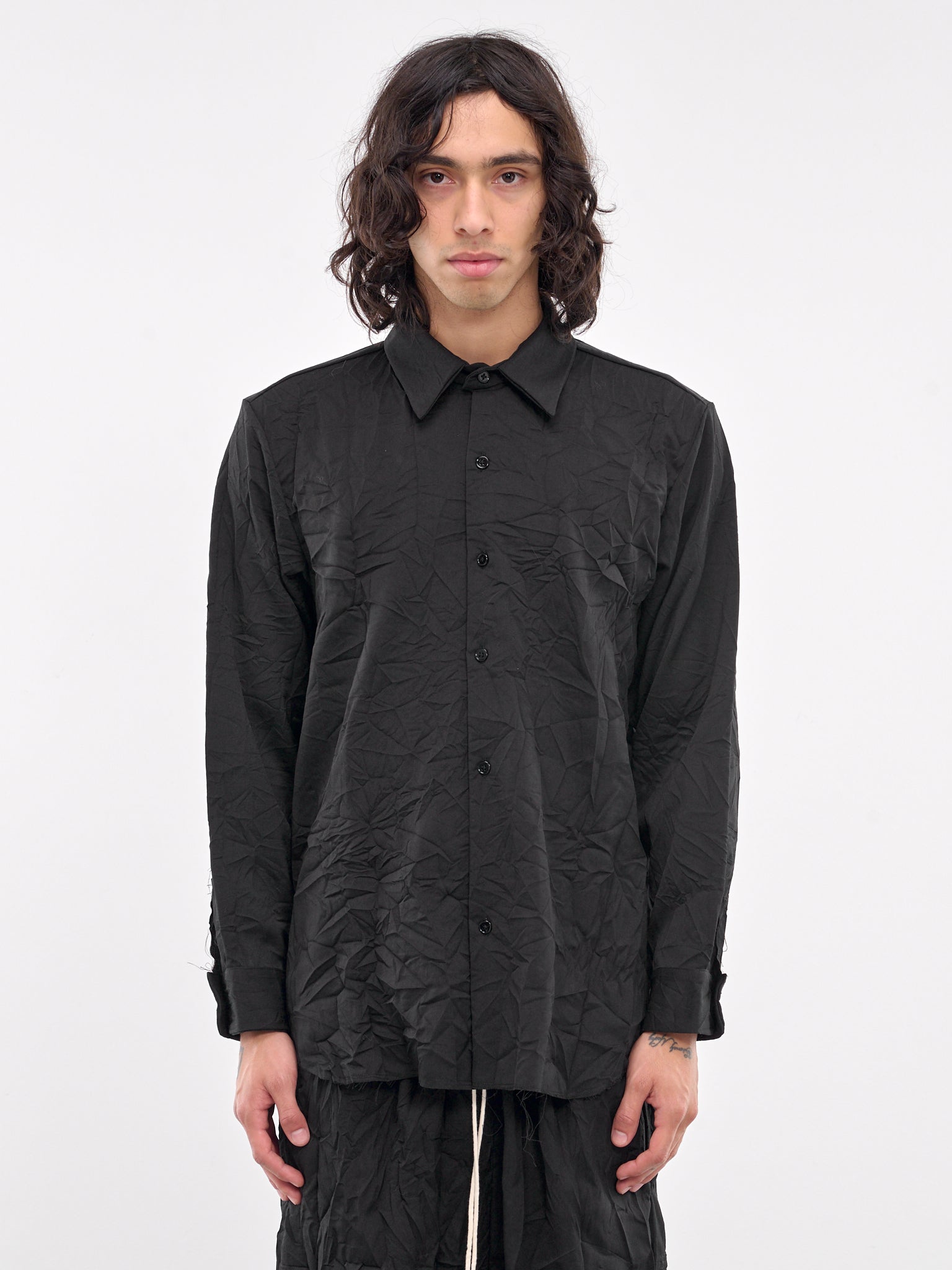 wrinkled dress shirt How to Reduce Wrinkles in Your Clothes