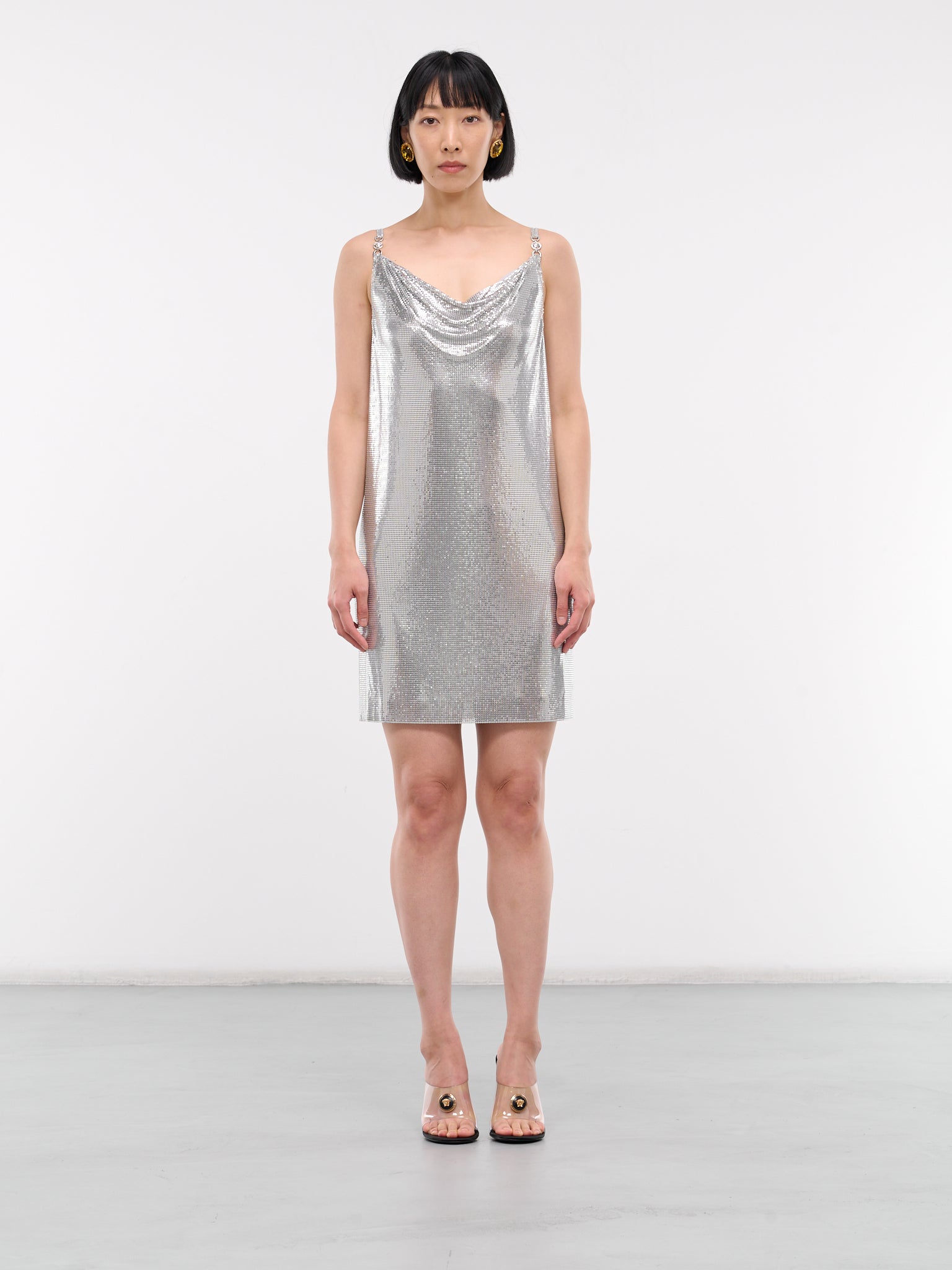metal mesh dress New Versace Silver Metallic Cut Out Black High Slit Gown It size 42 The dress is sleeveless and has a metallic finish. silver slip dress Metal Mesh